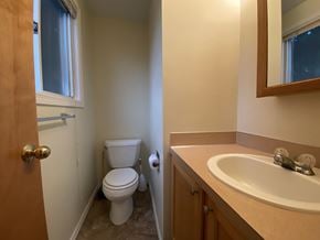 Sitka apartment for rent - an empty bathroom with a toilet and a sink