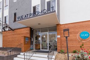 Oakland apartment for rent - The entrance to a building with a sign that reads "Vue at Piedmont".