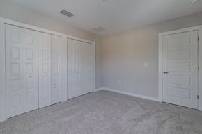 Tampa apartment for rent - a bedroom with two closets and two doors