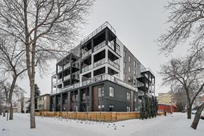 Edmonton apartment for rent - a black and white apartment building in the snow