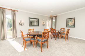 Ballwin apartment for rent - a dining room with a table and chairs