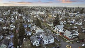 Tacoma apartment for rent - an aerial view of a neighborhood with houses and trees