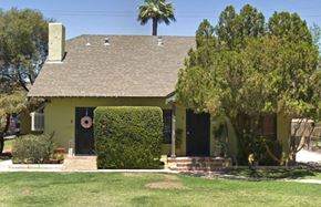 Phoenix apartment for rent - a green house with trees and a palm tree