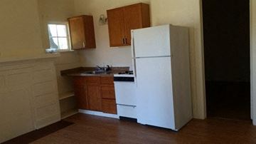 Phoenix apartment for rent - a kitchen with a white refrigerator and a sink