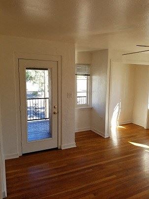 Phoenix apartment for rent - an empty living room with a door to a balcony