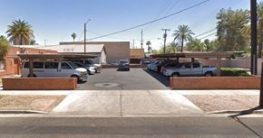 Phoenix apartment for rent - a row of cars parked in a parking lot