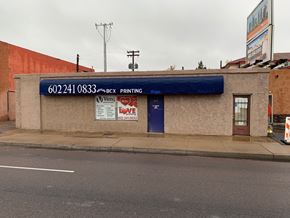 Phoenix apartment for rent - a building with a blue awning on the side of a street