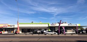 Phoenix apartment for rent - the front of a gas station with cars parked in front of it