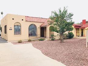 Phoenix apartment for rent - a house with a driveway and a tree in front of it