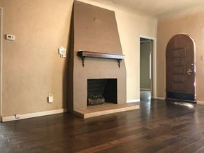 Phoenix apartment for rent - a living room with a fireplace and a wooden floor