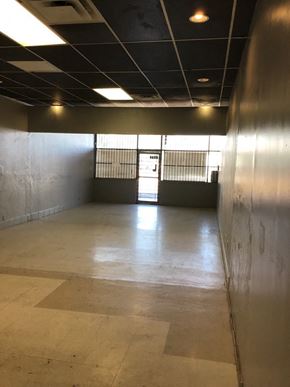 Phoenix apartment for rent - a large empty room with a door in the middle