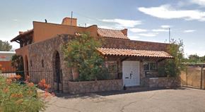 Phoenix apartment for rent - a brick house with a white door and a gate