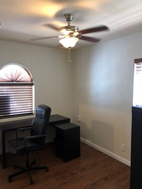Phoenix apartment for rent - an office with a ceiling fan and a desk