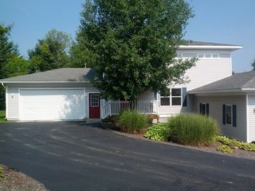 Ithaca apartment for rent - a white house with a tree in front of it