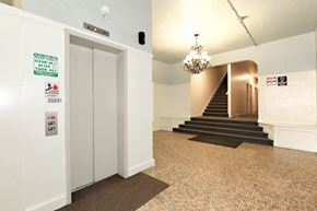Glendale apartment for rent - the lobby of a building with a staircase and a chandelier