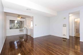 Los Angeles apartment for rent - A room with wooden floors and white walls.