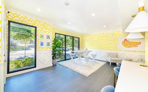 Dallas apartment for rent - a dining room with yellow wallpaper and a table and chairs