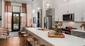 Chamblee apartment for rent - a kitchen with a large white counter top