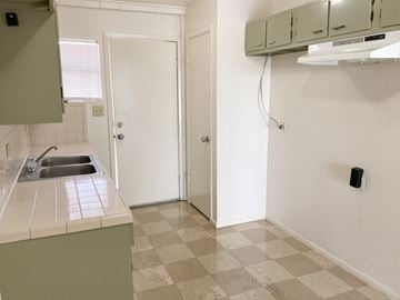 Laredo apartment for rent - A kitchen with a sink and a checkered floor.