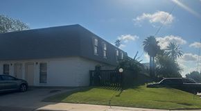 Laredo apartment for rent - a house with a yard and palm trees