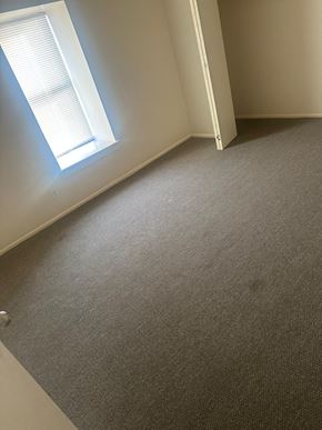 Laredo apartment for rent - a carpeted room with a window and a door