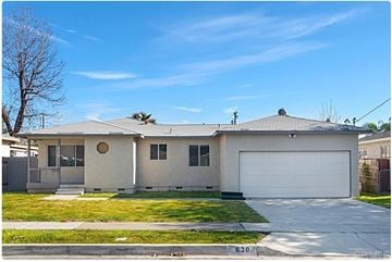 Escondido apartment for rent - a white house with a yard and a white garage door