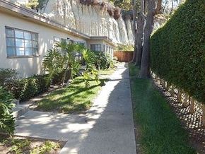San Diego apartment for rent - a sidewalk in front of a white house