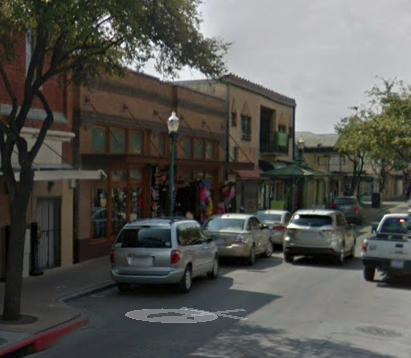 Laredo apartment for rent - a busy city street with cars driving down it