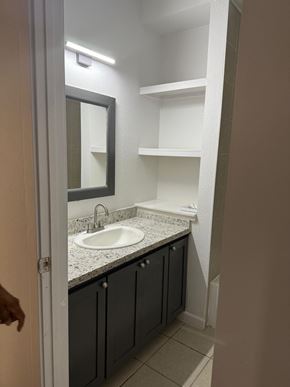 Laredo apartment for rent - A bathroom with a sink and a mirror.