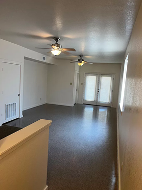 Laredo apartment for rent - an empty living room with two ceiling fans