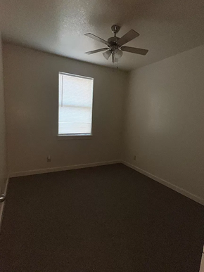 Laredo apartment for rent - an empty room with a ceiling fan and a window