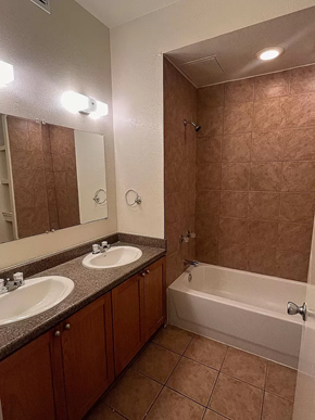 Laredo apartment for rent - a bathroom with two sinks and a bath tub
