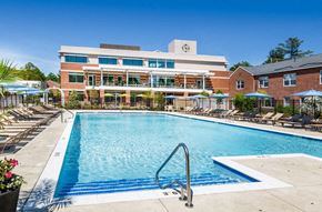 Chestnut Hill townhouse for rent - a swimming pool with a building in the background