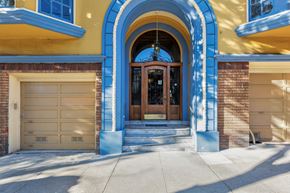 San Francisco apartment for rent - the front door of a blue and yellow house with a garage door