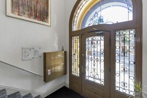 San Francisco apartment for rent - the front door of a building with a window and a mail box