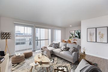San Francisco apartment for rent - A living room with a grey couch and a wooden coffee table.