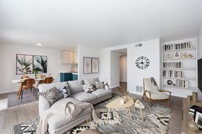 San Francisco apartment for rent - A living room with a white couch, a coffee table, and a bookshelf.