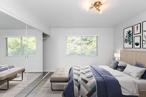 San Francisco apartment for rent - A bedroom with a bed, bench, and window.