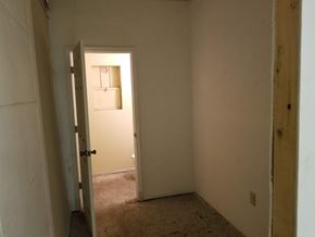Phoenix house for rent - a hallway with a door to a bathroom and a closet