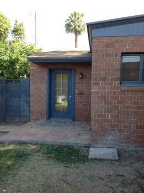 Phoenix apartment for rent - a small brick house with a blue door