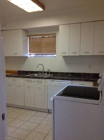 Phoenix apartment for rent - a kitchen with white cabinets and a sink