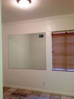 Phoenix apartment for rent - a living room with a large mirror and a window