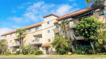 Los Angeles apartment for rent - A building with a red tile roof and a balcony.