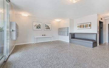 West Hollywood apartment for rent - a living room with a couch and a table