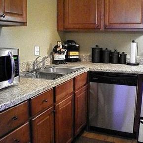 Oklahoma City apartment for rent - a kitchen with a stainless steel dishwasher and a sink