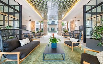 Orlando apartment for rent - a living room with couches and chairs and a coffee table