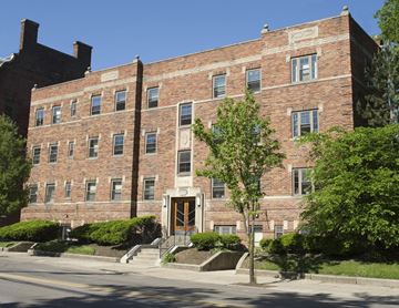 Cincinnati apartment for rent - A red brick building with a tree in front of it.