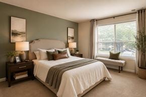 Glen Burnie apartment for rent - A bedroom with a large bed and a window seat.