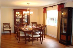 Cranston apartment for rent - a dining room with a wooden table and chairs