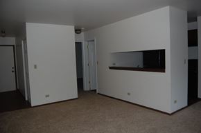 Lake Bluff apartment for rent - A white room with a brown carpet and a fireplace.